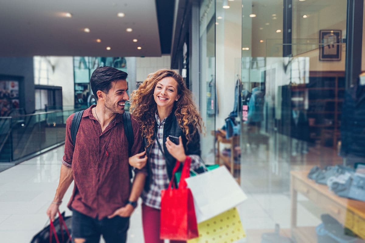 A man in a woman in a shopping mall