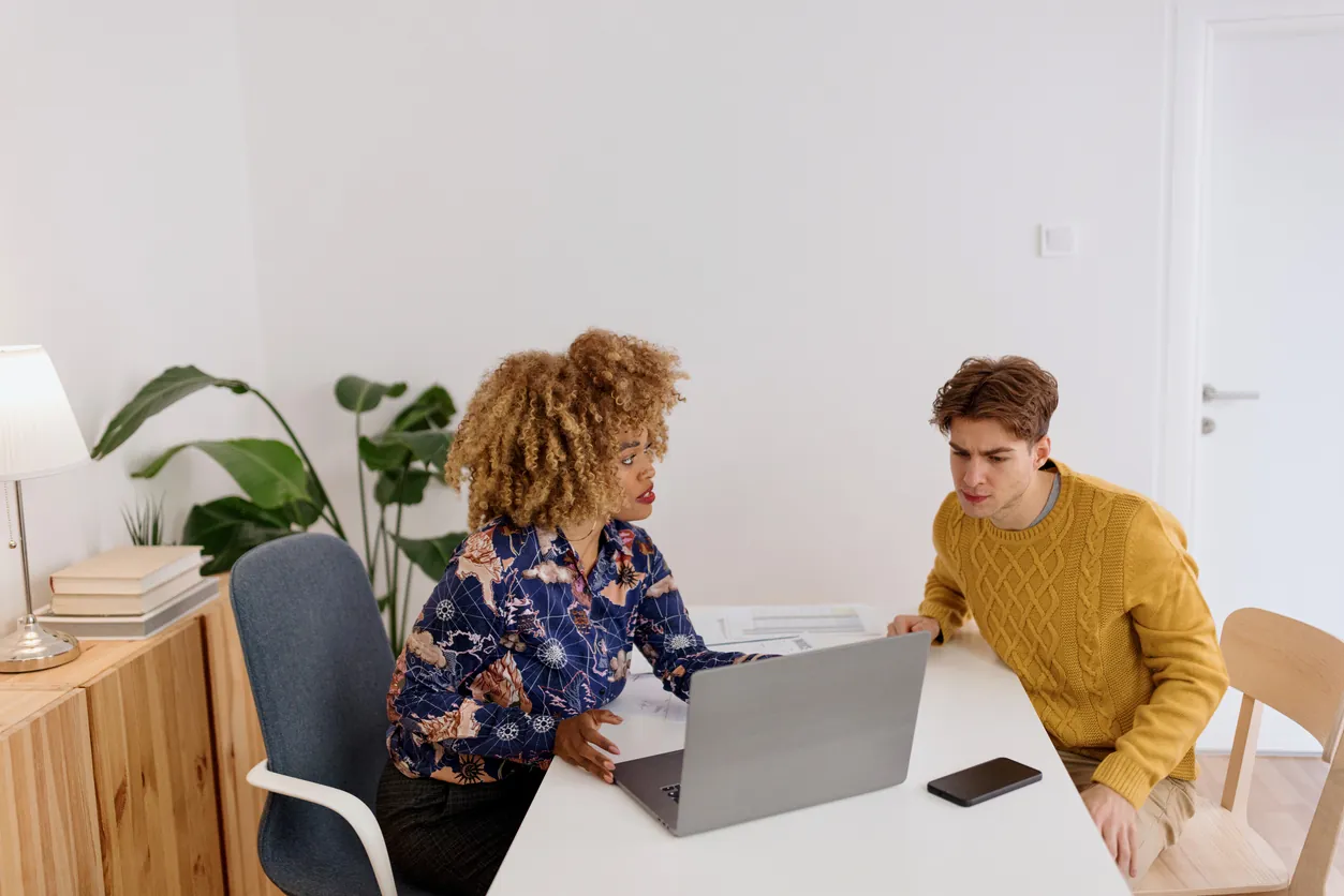 Confident businesswoman advising client on finance