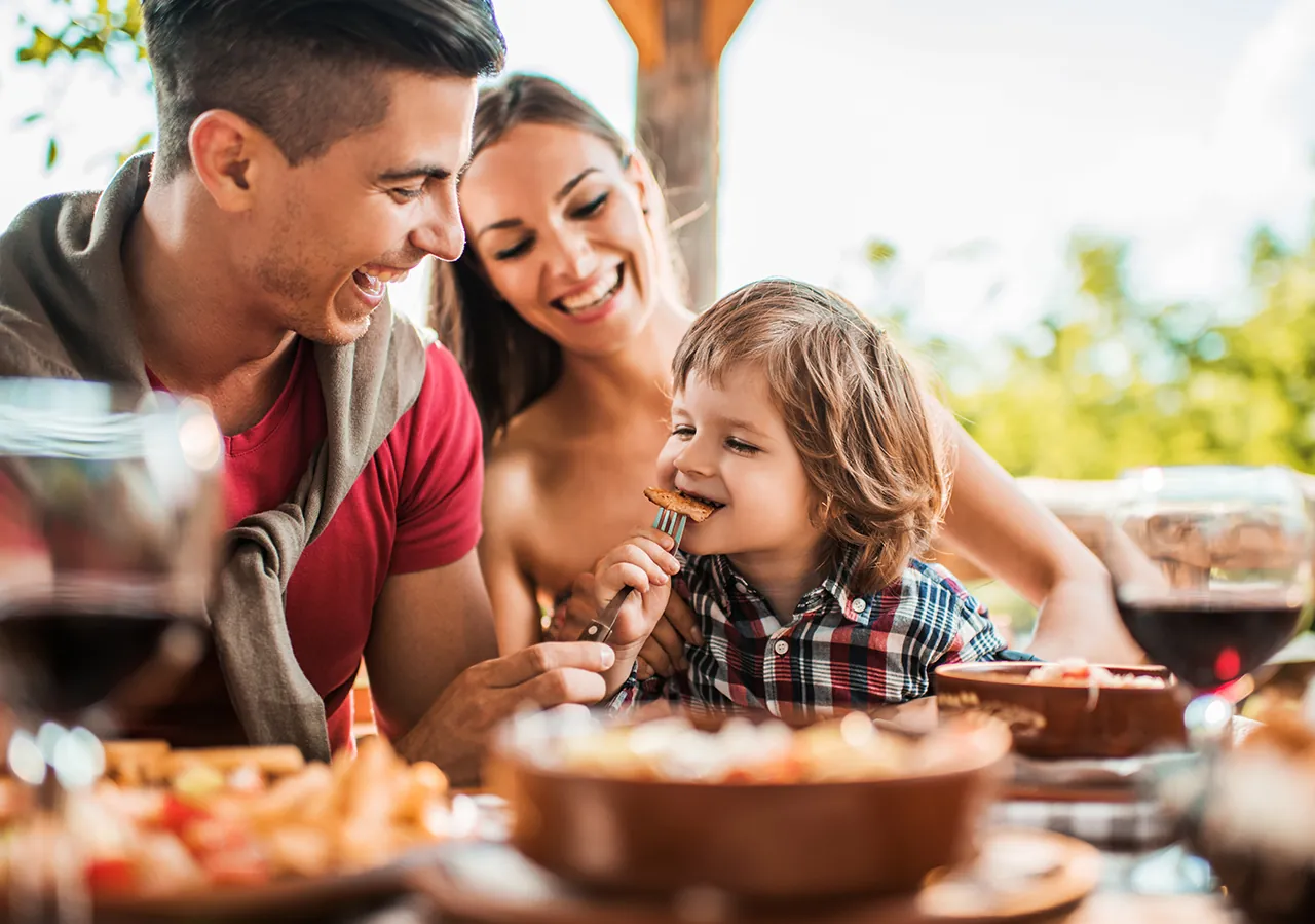 InMoment + Jack in the Box partnership: image of a family at a table eating together